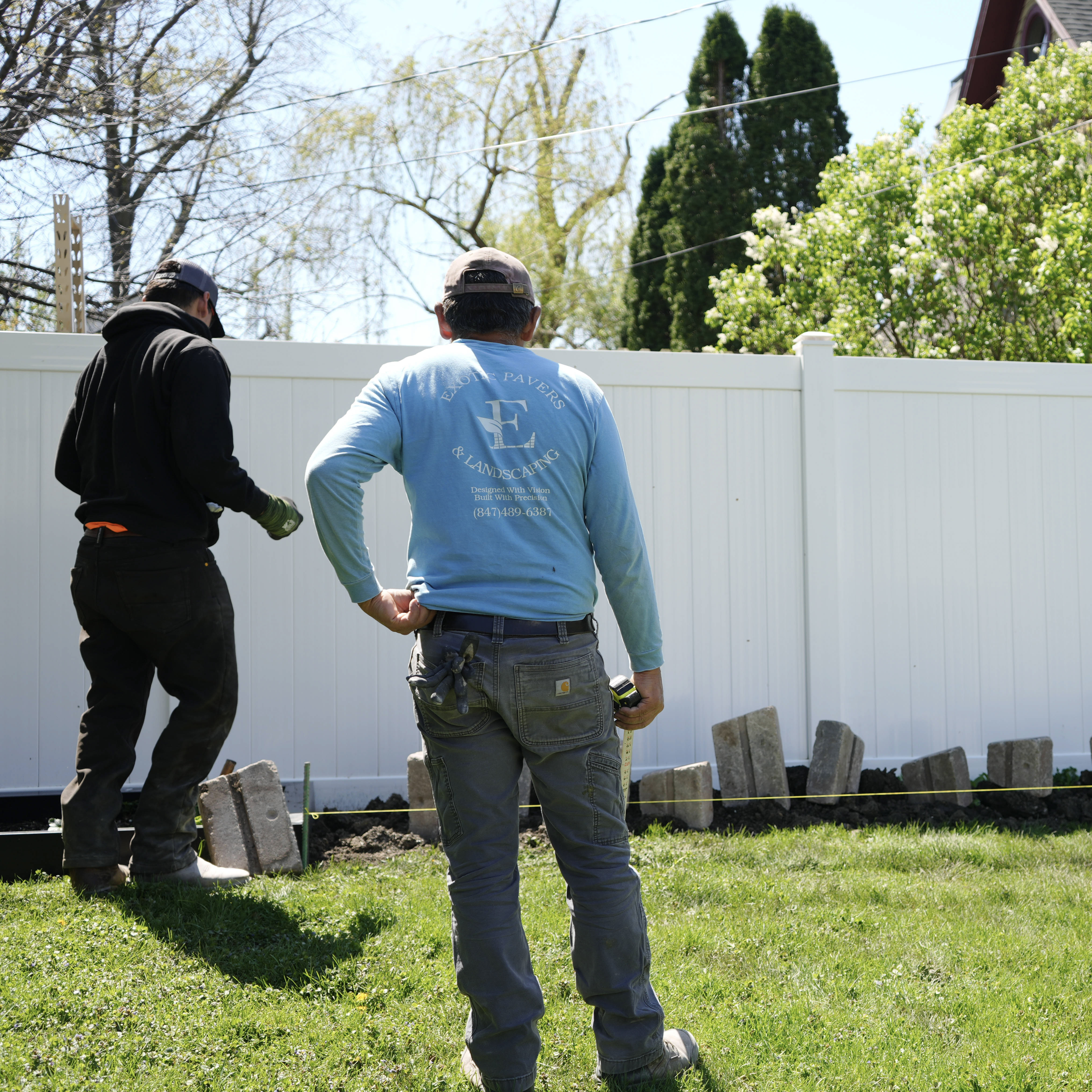 EP&L crew on-site in branded shirts, mid-install at a residential property.