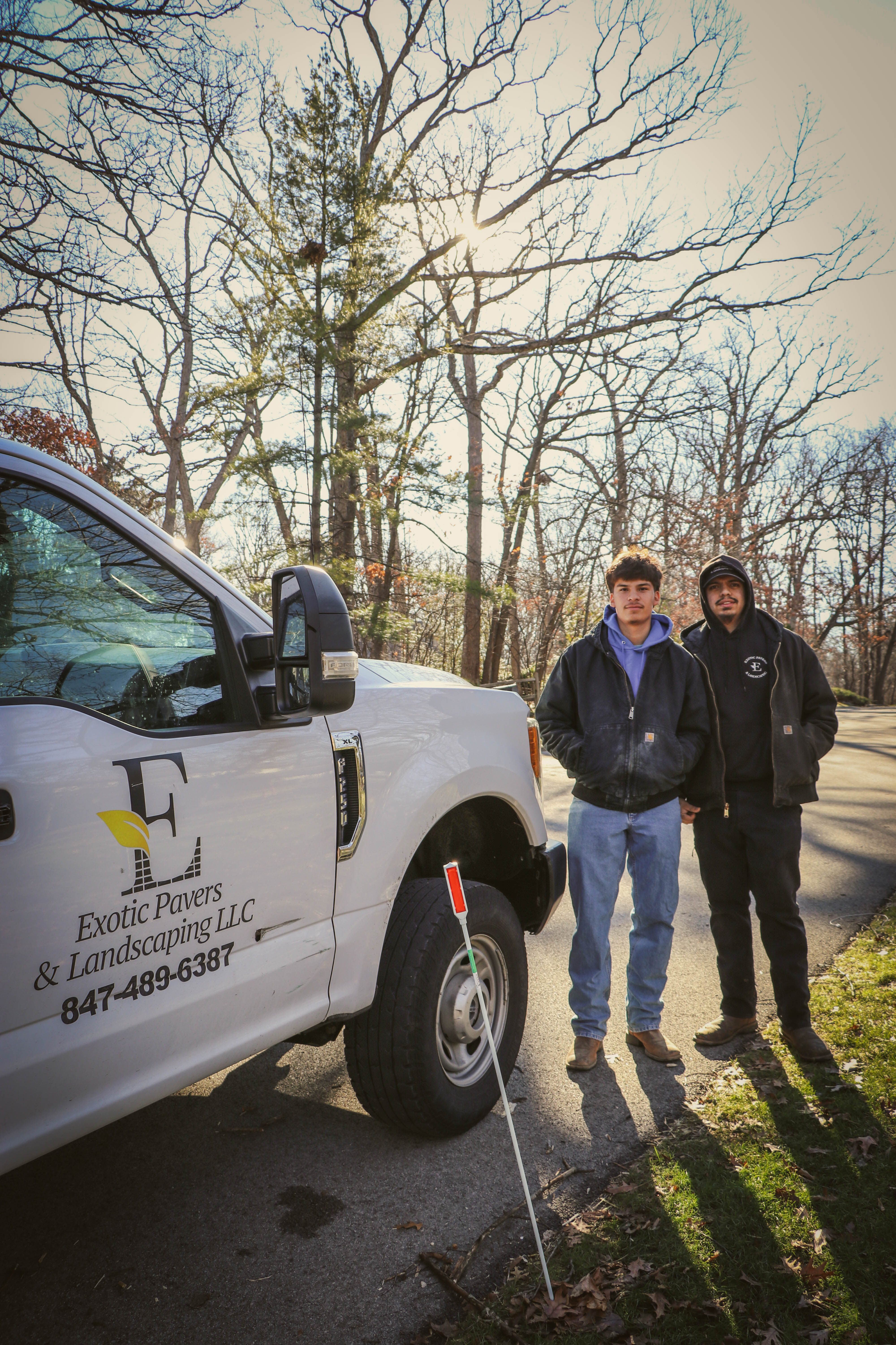 Edgar and the EP&L crew standing beside the company truck — Chicagoland, January 2026.
